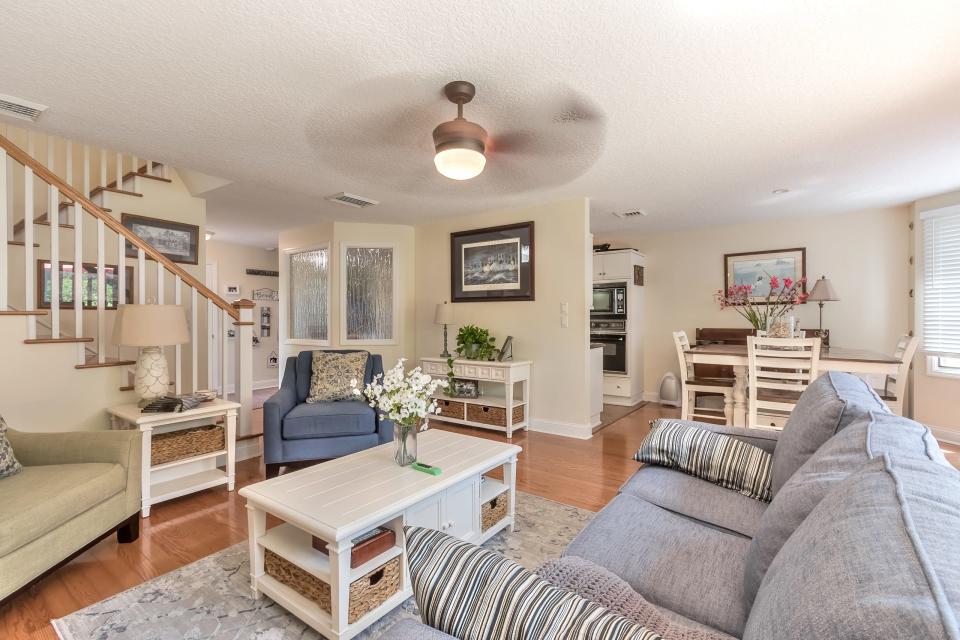 This beachside townhome was recently renovated, with ceramic tile, hardwood floors, a wood-burning fireplace, a wet bar/coffee bar, stainless-steel appliances, updated lighting, blinds and a custom garage.