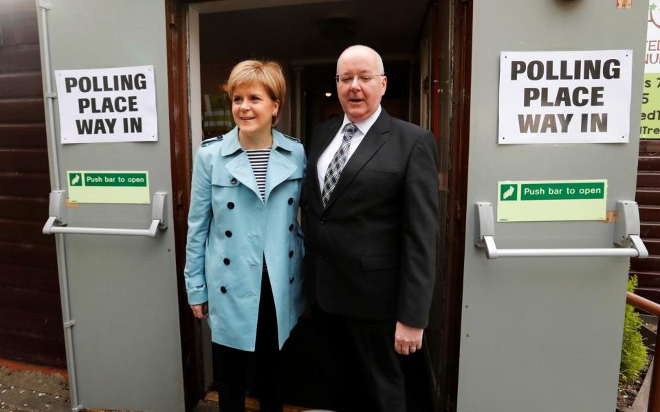 Nicola Sturgeon casts her vote - along with husband and SNP chief executive Peter Murrell - at the 2017 general election. - RUSSELL CHEYNE/Reuters
