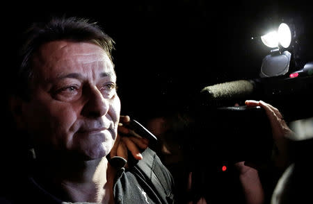 FILE PHOTO: Italian former leftist guerrilla Cesare Battisti leaves the headquarters of the Federal Police in Sao Paulo March 13, 2015. REUTERS/Nacho Doce/File Photo