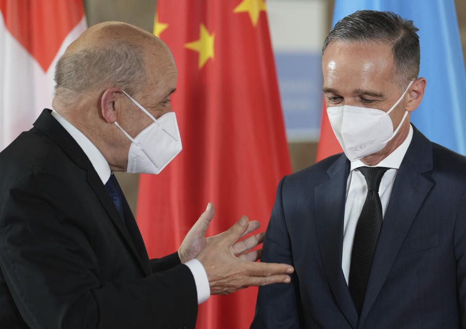 German Foreign Minister Heiko Maas, right, welcomes French Foreign Minister Jean-Yves Le Drian for the 'Second Berlin Conference on Libya' at the foreign office in Berlin, Germany, Wednesday, June 23, 2021. (AP Photo/Michael Sohn, pool)