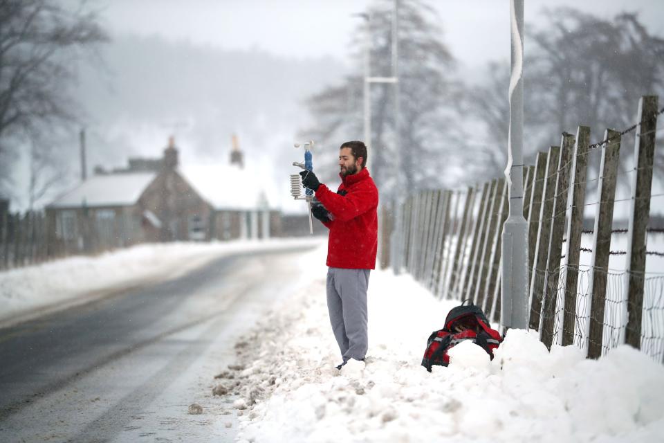 Meteorologist takes measurements for the Met Office in Aberdeenshire, Scotland/Getty Images