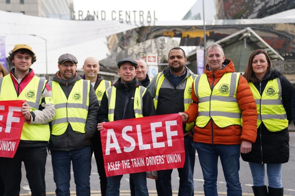 Rail workers on the picket line at Grand Central Station in Birmingham, as members of the drivers' union Aslef at 11 companies go on strike amid warnings of further walkouts in a long-running dispute over pay (PA)