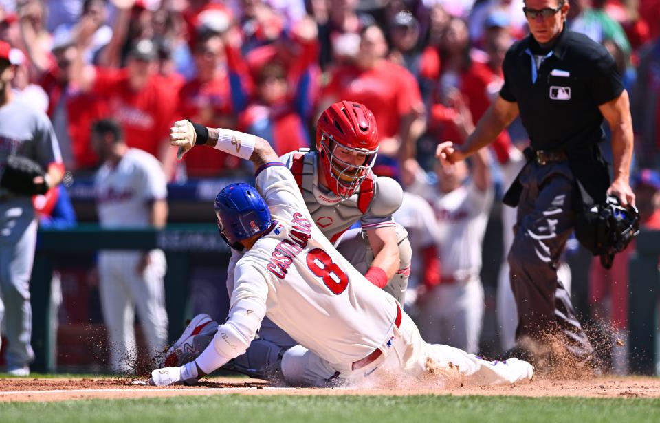 Apr 9, 2023; Philadelphia, Pennsylvania, USA; Cincinnati Reds catcher Tyler Stephenson (37) tags out Philadelphia Phillies outfielder Nick Castellanos (8) in the first inning at Citizens Bank Park. Mandatory Credit: Kyle Ross-USA TODAY Sports