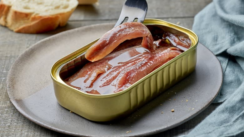 canned anchovies on a plate