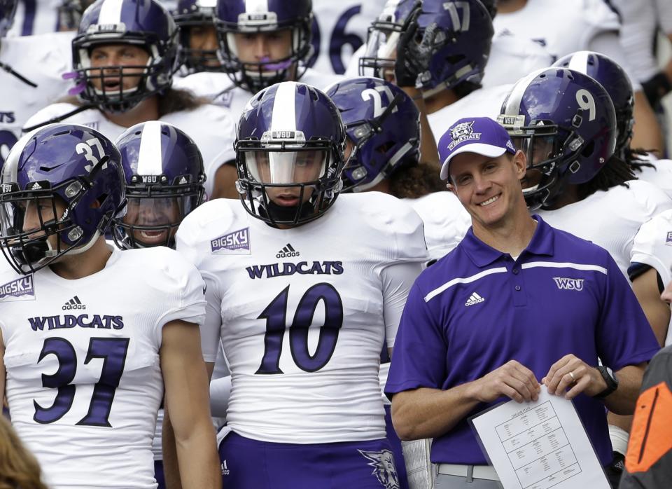 Weber State had football coach Jay Hill is shown with his team before an NCAA college football game against Oregon State in Corvallis, Ore., Friday, Sept. 4, 2015. (AP Photo/Don Ryan)