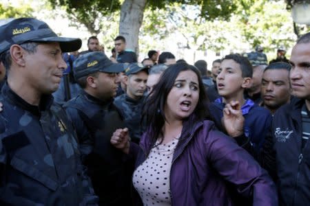 A woman shout slogans during demonstrations on the seventh anniversary of the toppling of president Zine El-Abidine Ben Ali, in Tunis, Tunisia January 14, 2018. REUTERS/Youssef Boudlal