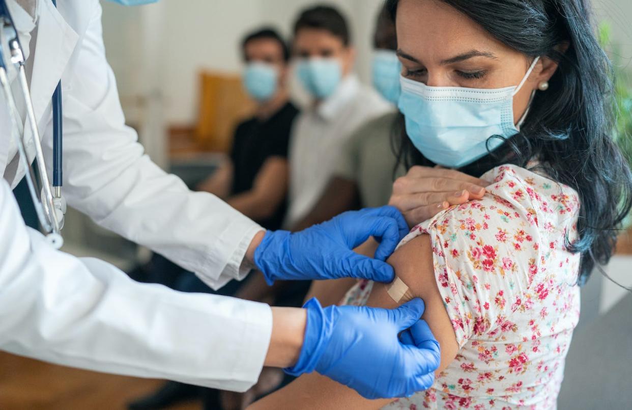 In a matter of days, eligible people will be lining up to receive the newly formulated booster shot. <a href="https://www.gettyimages.com/detail/photo/vaccination-center-royalty-free-image/1358994941?adppopup=true" rel="nofollow noopener" target="_blank" data-ylk="slk:filadendron/E+ via Getty Images;elm:context_link;itc:0;sec:content-canvas" class="link ">filadendron/E+ via Getty Images</a>