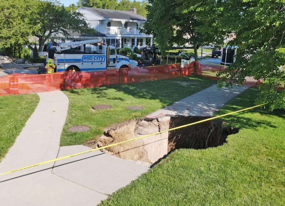 A sinkhole at Big Bay Park on North Lake Drive in Whitefish Bay is seen on Monday, June 10, 2024.
