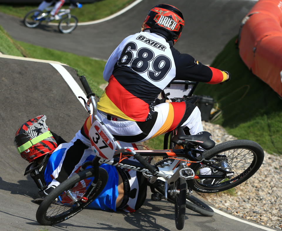 LONDON, ENGLAND - AUGUST 09: Maik Baier of Germany crashes into Tory Nyhaug of Canada during the Men's BMX Cycling Quarter Finals on Day 13 of the London 2012 Olympic Games at BMX Track on August 9, 2012 in London, England. (Photo by Phil Walter/Getty Images)