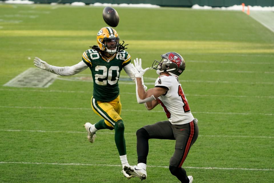 Tampa Bay Buccaneers’ Scott Miller catches a 39-yard touchdown pass against Green Bay Packers’ Kevin King right before halftime of the NFC championship game Jan. 24, 2021, at Lambeau Field. The TD put the Buccaneers up 21-10.