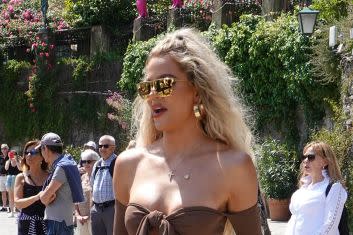 Khloé Kardashian Takes to the Streets of Italy in Lace-Up Knee