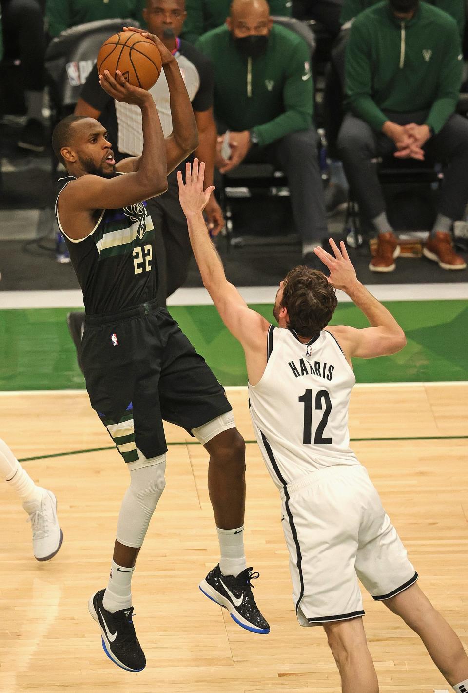 Khris Middleton shoots over Brooklyn's Joe Harris in Game 6 of the 2021 Eastern Conference semifinals. Middleton had 38 points.