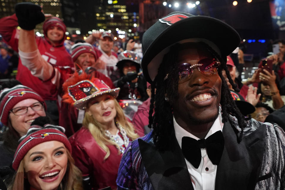 Missouri defensive lineman Darius Robinson poses with fans after being chosen by the Arizona Cardinals with the 27th overall pick during the first round of the NFL football draft, Thursday, April 25, 2024, in Detroit. (AP Photo/Paul Sancya)