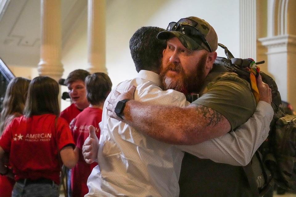 Veterans for Equality member Benjamin Clodfelter gives a hug after Senate Bill 14 was delayed Friday at the Capitol. SB 14 would ban gender-affirming medical care for transgender children.