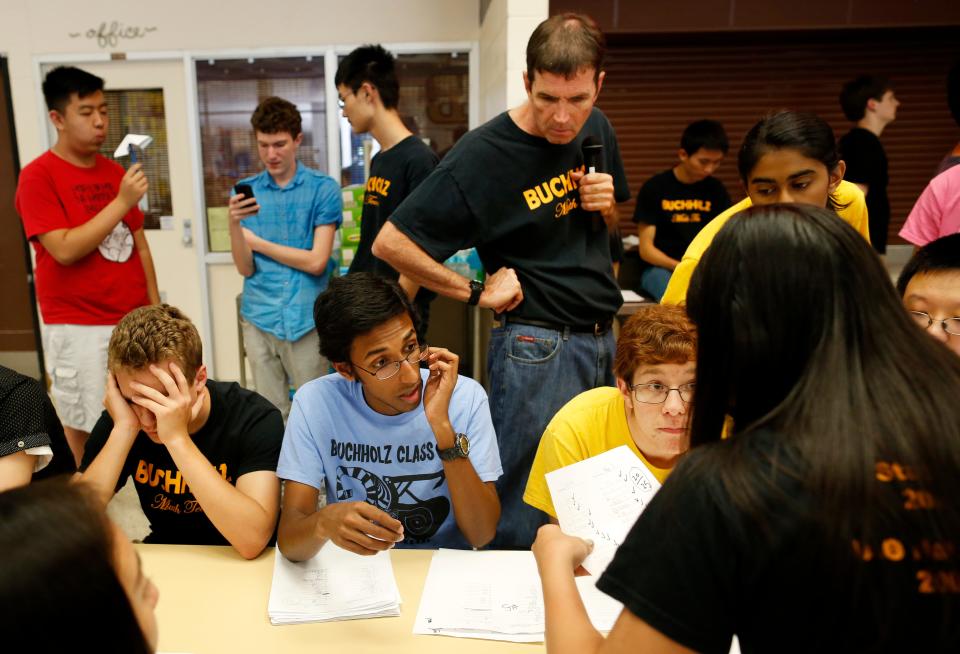 Buchholz High School math teacher and math team coach Will Frazer and his team grade tests during the Superintendent's Math Challenge at Buchholz High School in 2015. Frazer has built a dynasty of championship teams.