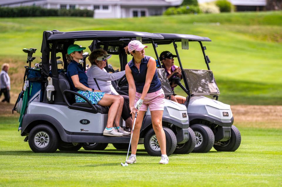 Jillian Grolley looks at her approach on hole 13 at the CCNB Women's Fourball Tournament.