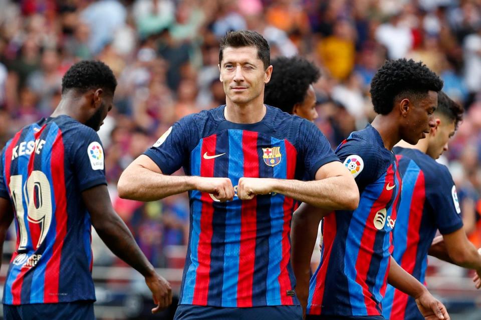 Robert Lewandowski celebrates after opening the scoring for Barcelona against Elche (Joan Monfort/AP) (AP)