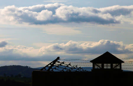 FILE PHOTO: A watch tower is pictured at the former Austrian Nazi concentration camp in Mauthausen May 7, 2010. REUTERS/Herwig Prammer/File Photo