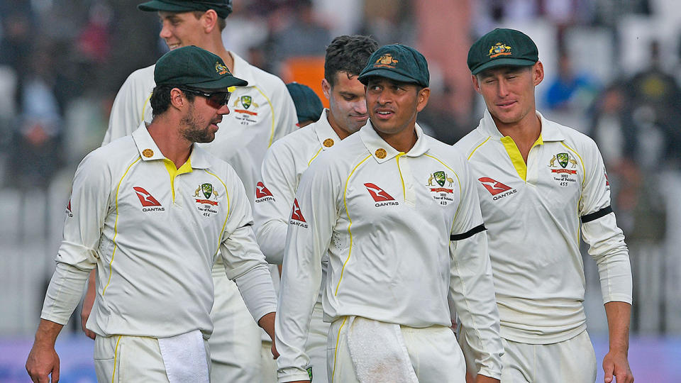 Australia endured a lengthy slog in the field against Pakistan, only to emerge with a draw after five days. (Photo by AAMIR QURESHI/AFP via Getty Images)