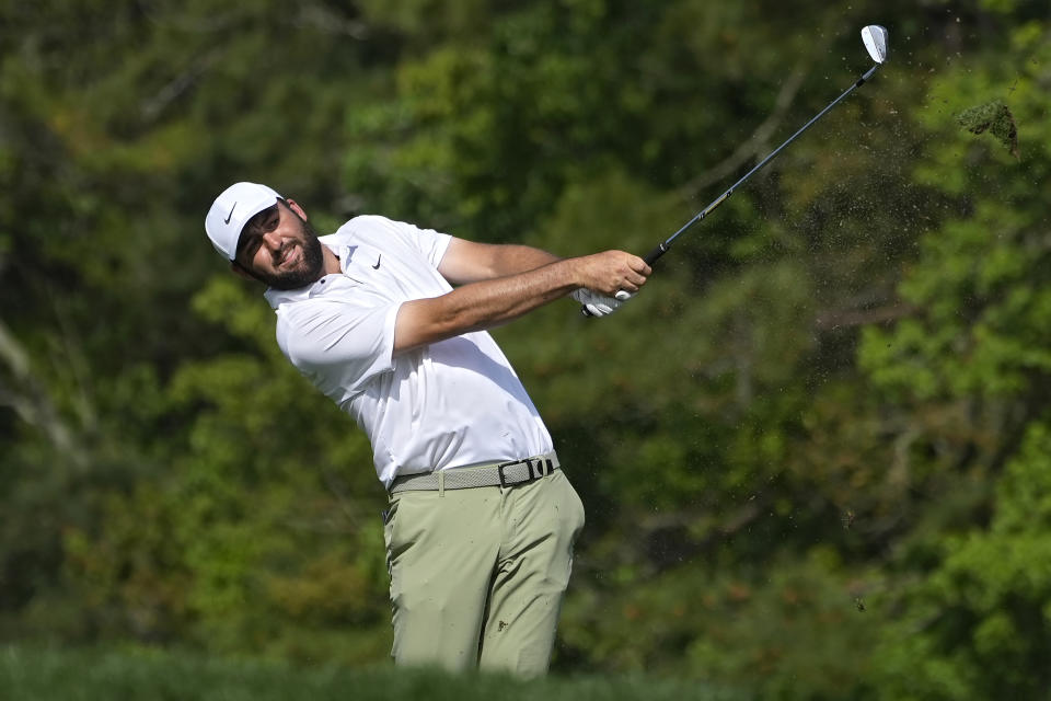 Scottie Scheffler hits his tee shot on the 14th hole during the final round of The Players Championship golf tournament Sunday, March 17, 2024, in Ponte Vedra Beach, Fla. (AP Photo/Marta Lavandier)