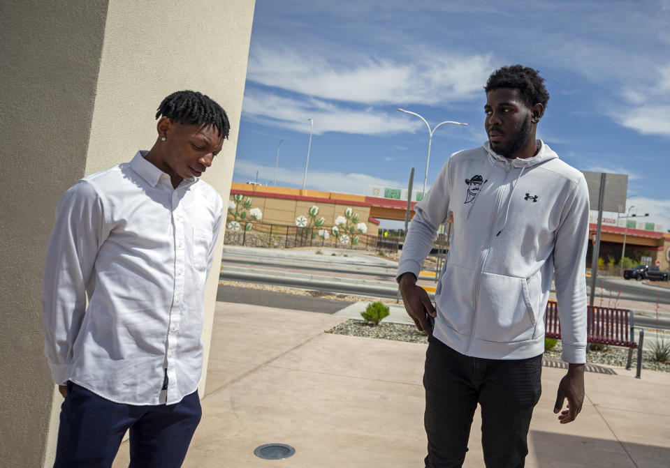 Former New Mexico State NCAA college basketball players Shak Odunewu, right, and Deuce Benjamin chat after a news conference in Las Cruces, N.M., Wednesday, May 3, 2023. Odunewu and Benjamin discussed the lawsuit they filed alleging teammates ganged up and sexually assaulted them multiple times, while their coaches and others at the school didn't act when confronted with the allegations. (AP Photo/Andres Leighton)