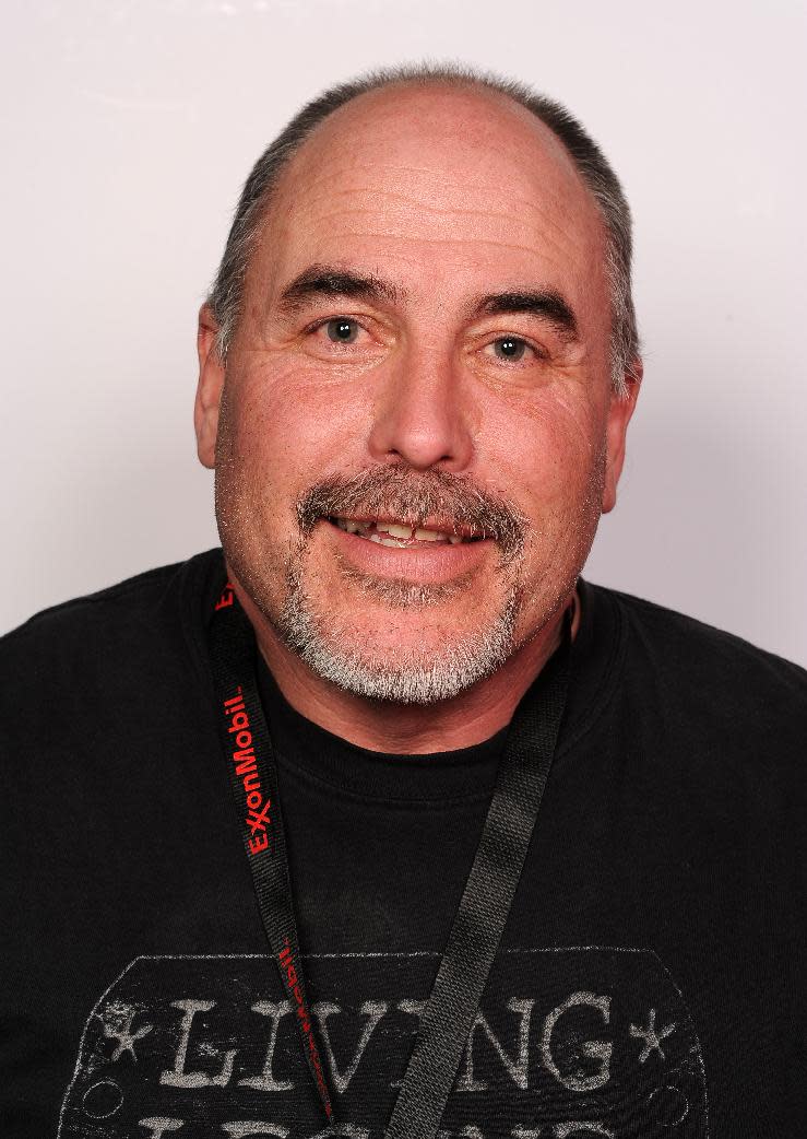 In this Feb. 27, 2014, photo, Iditarod Trail Sled Dog Race musher Scott Janssen pauses for a photo at the draw banquet in Ancharage, Alaska. Janssen was flown to a hospital after a harrowing ordeal that included crashing his sled, hitting his head on a stump and later falling through ice and breaking his ankle. Janssen, an Anchorage undertaker known as the Mushing Mortician, was back home early Wednesday, March 5, 2014, after getting a cast for the broken bone he suffered on Tin Creek, about 40 miles from Nikolai. (AP Photo/Anchorage Daily News, Bob Hallinen)