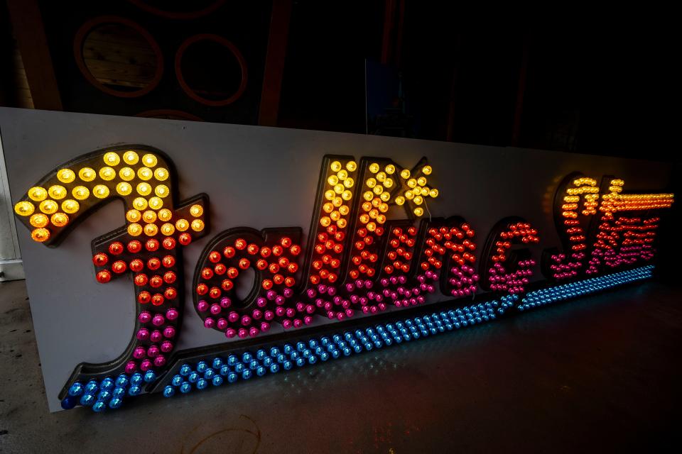 The refurbished sign of the former Falling Star ride is seen inside Falling Star Lounge at Adventureland on Thursday, April 18, 2024, in Altoona. The Falling Star Lounge will house the sign after the ride itself was removed from the park.