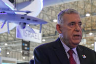 Boaz Levy, the CEO of Israel Aerospace Industries, speaks to The Associated Press at the Dubai Air Show in Dubai, United Arab Emirates, Monday, Nov. 15, 2021. Israel is taking part in the Dubai Air Show for the first time after the United Arab Emirates recognized the country last year. (AP Photo/Jon Gambrell)