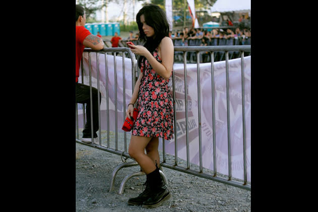 Saab wears a cute floral dress on her first gig ever with her all-girl band Duster.