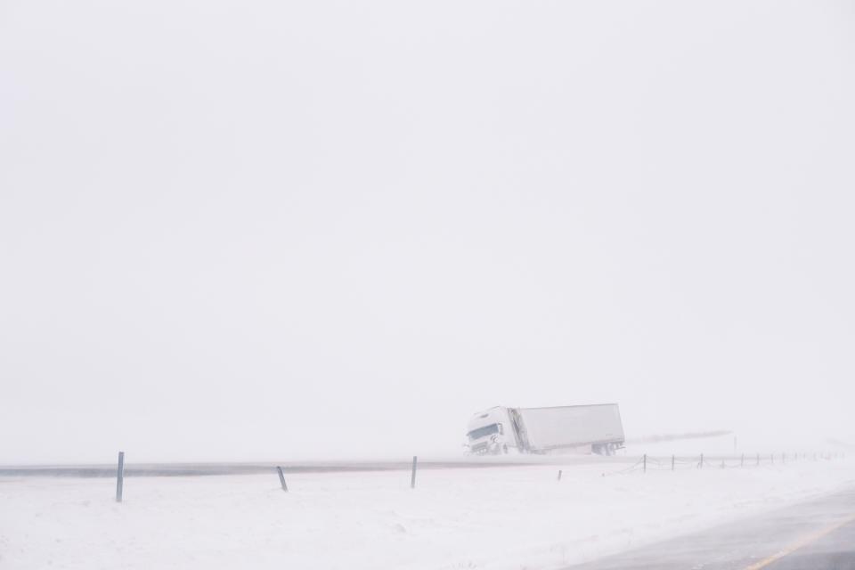 An crashed semi truck sits abandoned along Interstate 80 in central Iowa on Saturday, Jan. 13, 2024. Heavy snow and high winds led the National weather service to issue a blizzard warning for much of the state of Iowa. (Nick Rohlman /The Gazette via AP) ORG XMIT: IACED605
