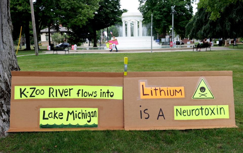 Some of the many signs near the Brooks Memorial Fountain during a weekly protest against the Ford electric vehicle battery plant in downtown Marshall on Wednesday, July 12, 2023. Protesters generally show up on Wednesdays and Saturdays.
(Credit: Eric Seals, Detroit Free Press)