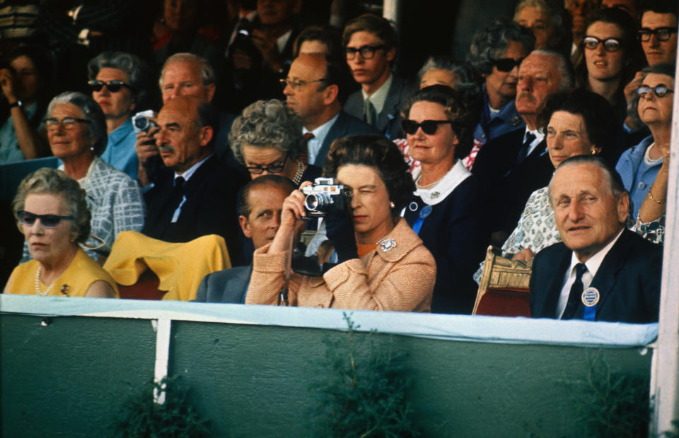 <p>The Queen, an avid photographer, takes a picture of her daughter, Princess Anne, as she competes in horse trials at Burghley, Lincolnshire, where she became individual Three-Day Event Champion. (Getty Images)</p> 