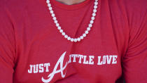 Atlanta Braves' Joc Pederson wears pearls during a workout ahead of baseballs National League Championship Series against the Los Angeles Dodgers, Friday, Oct. 15, 2021, in Atlanta. (AP Photo/John Bazemore)