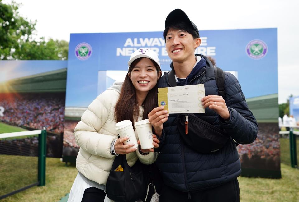 Tennis fans in the queue on day two of the 2023 Wimbledon Championships at the All England Lawn Tennis and Croquet Club in Wimbledon. Picture date: Tuesday July 4, 2023.