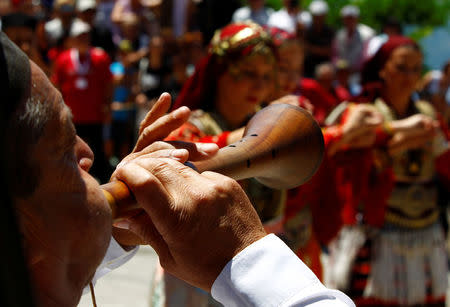 People dressed in folk costumes take part in a traditional wedding ceremony in the village of Galicnik, west of capital Skopje, Macedonia July 15, 2018. REUTERS/Ognen Teofilovski