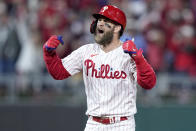 Philadelphia Phillies' Bryce Harper celebrates after his RBI double during the fifth inning in Game 4 of the baseball NL Championship Series between the San Diego Padres and the Phillies on Saturday, Oct. 22, 2022, in Philadelphia. (AP Photo/Matt Rourke)