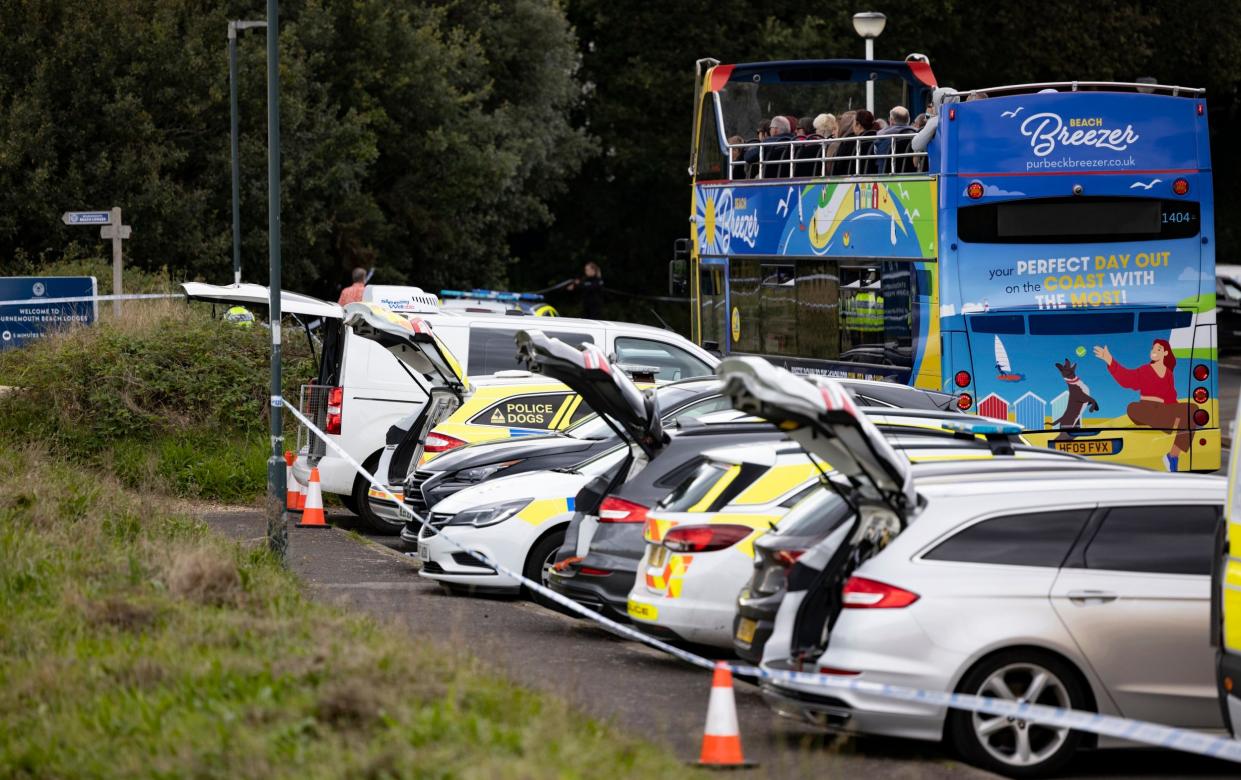 Police vehicles at the seafront scene after Shotton's body was found in August 2023