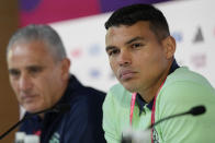 Brazil's Thiago Silva, right, and head coach Tite listen to a question during a press conference on the eve of the group G of World Cup soccer match between Brazil and Serbia, in Doha, Qatar, Wednesday, Nov. 23, 2022. (AP Photo/Andre Penner)