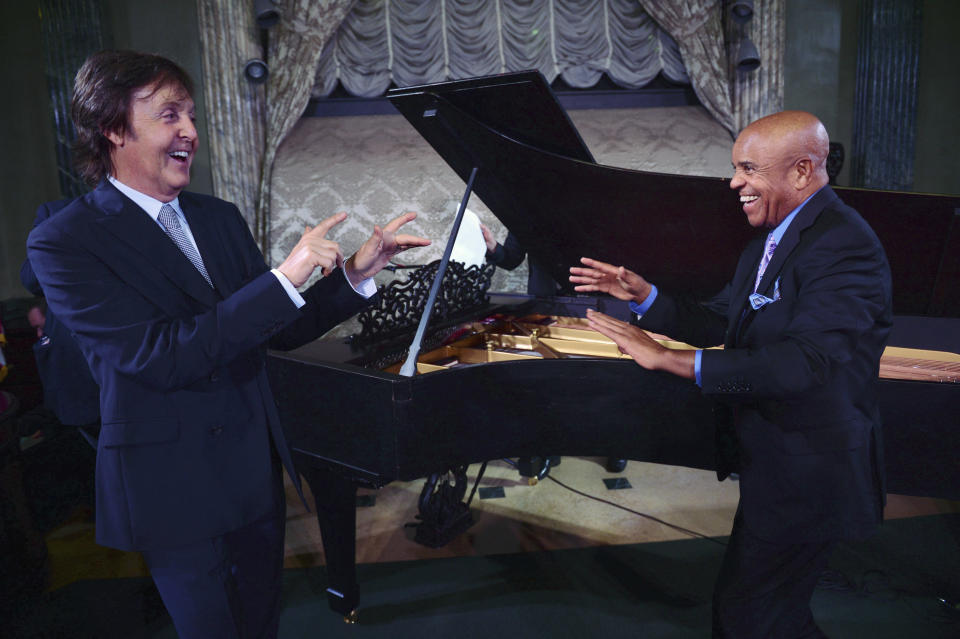 FILE - In this Sept. 18, 2012 file photo provided by the Motown Museum, Paul McCartney, left, and Berry Gordy stand in front of a newly restored 1877 Steinway grand piano during a benefit at the Motown Museum at Steinway Hall in New York. The piano, used by Motown greats during the label's heyday, was restored with an assist by McCartney. In an April 1, 2013 news release from the museum, it was announced that the famed 9-foot piano has been returned to Detroit and will go back on display at the Motown museum's famed Studio A in the "Hitsville, U.S.A.," building. (AP Photo/Motown Museum, Shahar Azran, File) MANDATORY CREDIT