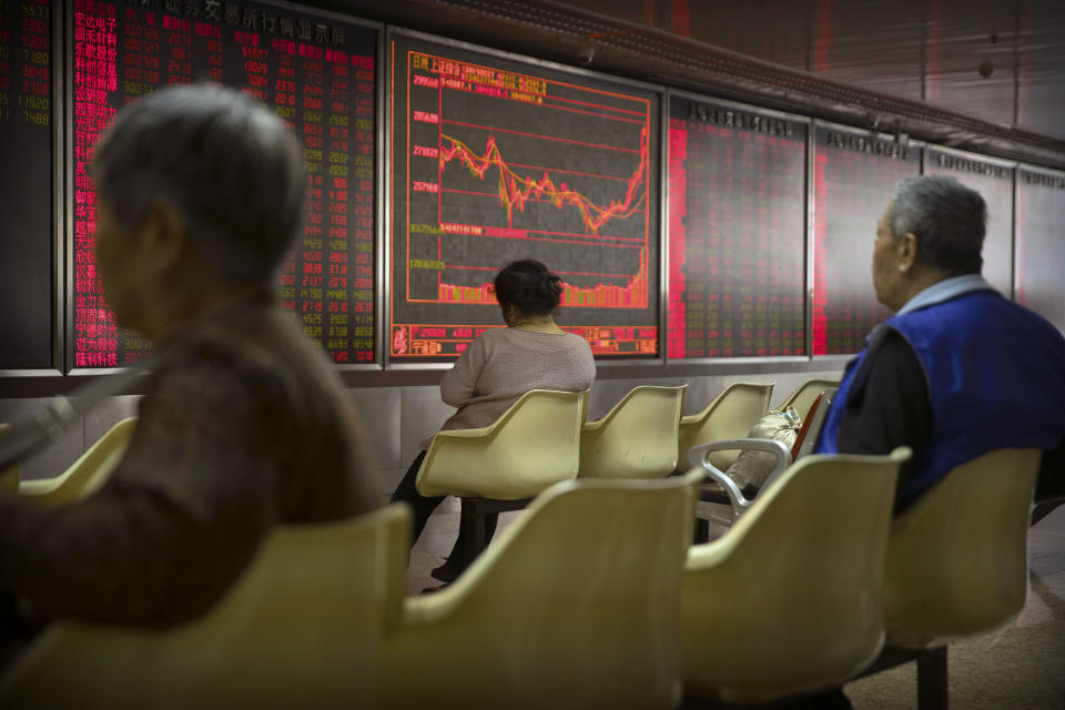 Chinese investors monitor stock prices at a brokerage house in Beijing, Wednesday, Feb. 27, 2019. Asian shares were higher in muted trading Wednesday as investors watch the second summit between President Donald Trump and North Korean leader Kim Jong Un in Vietnam. (AP Photo/Mark Schiefelbein)