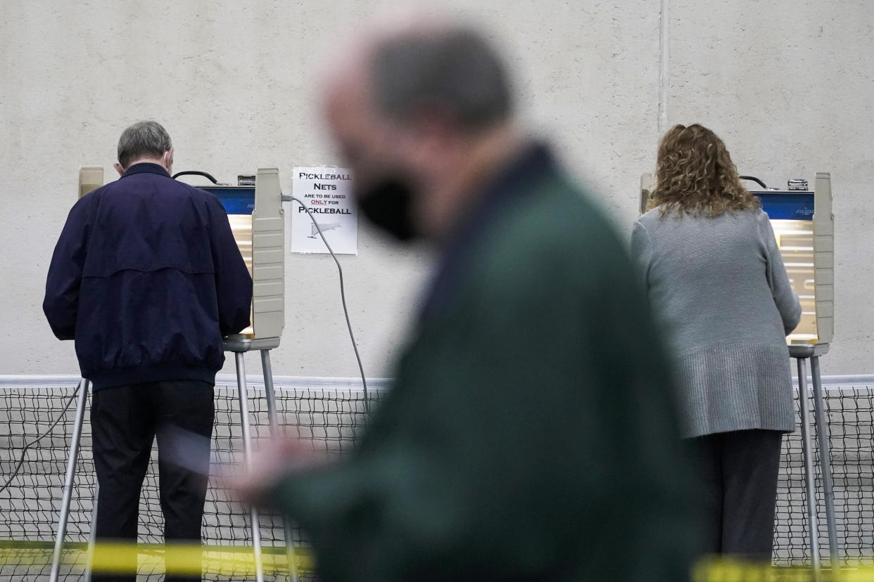 FILE - People vote at the Milwaukee County Sports Complex, on Nov. 3, 2020, in Franklin, Wis. Donald Trump may hold a tight grasp on much of the Republican base, but there's a notable minority of GOP voters who don’t consider themselves members of his “Make America Great Again” movement. Most did back party candidates in 2022, AP VoteCast shows. Still, the extensive national survey finds these Republicans made up a larger percentage of those who opted not to support a candidate in House races. (AP Photo/Morry Gash, File)