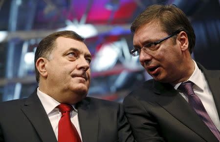 Milorad Dodik (L), president of the Republika Srpska, and Serbian Prime Minister Aleksandar Vucic attend the official celebration ceremony of Republika Srpska Statehood Day in Banja Luka, Bosnia and Herzegovina, January 9, 2015. REUTERS/Dado Ruvic