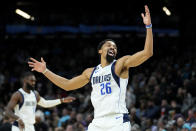 Dallas Mavericks guard Spencer Dinwiddie (26) celebrates a three pointer against the Phoenix Suns during the second half of an NBA basketball game, Thursday, Jan. 26, 2023, in Phoenix. (AP Photo/Matt York)