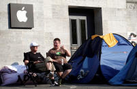 Customers wait beside their tents outside an Apple store to buy the newly released Apple iPhone 7 at Kurfuerstendamm boulevard in Berlin, Germany, September 12, 2016. REUTERS/Fabrizio Bensch