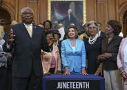From left, Majority Whip James Clyburn, D-S.C., Speaker of the House Nancy Pelosi, D-Calif., Rep. Joyce Beatty, D-Ohio, and Rep. Maxine Waters, D-Calif., and members of the Congressional Black Caucus celebrate the passage of the Juneteenth National Independence Day Act that creates a new federal holiday to commemorate June 19, 1865, when Union soldiers brought the news of freedom to enslaved Black people after the Civil War, at the Capitol in Washington, Thursday, June 17, 2021. It's the first new federal holiday since Martin Luther King Jr. Day was created in 1983. (AP Photo/J. Scott Applewhite)