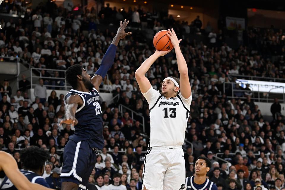 Friars forward Josh Oduro shoots over Hoyas forward Supreme Cook during the first half of Saturday's Big East game.