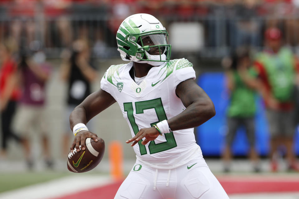 Oregon quarterback Anthony Brown drops back to pass against Ohio State during the first half of an NCAA college football game Saturday, Sept. 11, 2021, in Columbus, Ohio. (AP Photo/Jay LaPrete)