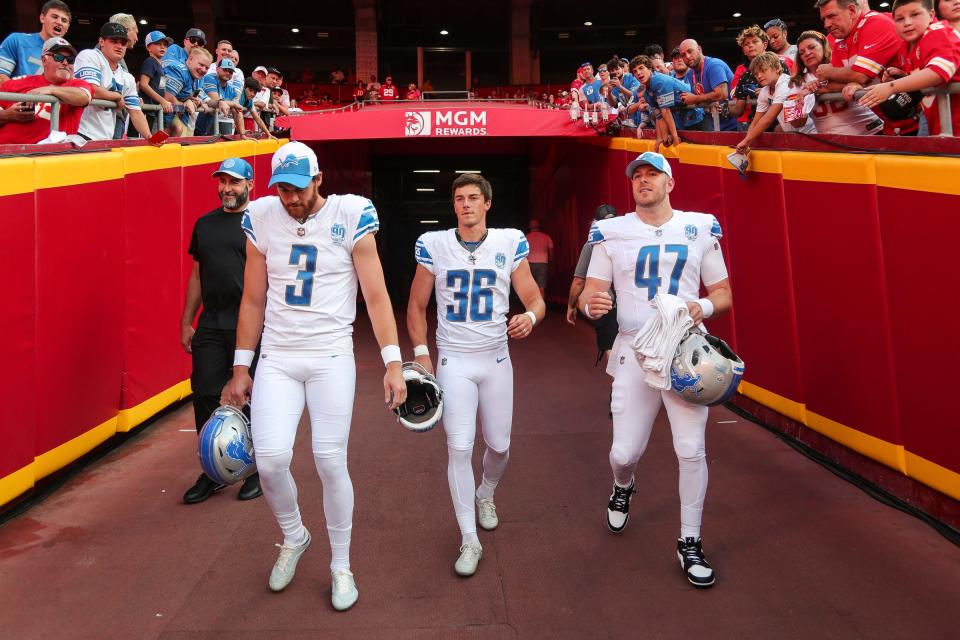From left, Detroit Lions punter Jack Fox (3), place kicker Riley Patterson (36) and long snapper Scott Daly (47) take the field for warmup ahead of the season opener against the Kansas City Chiefs at Arrowhead Stadium in Kansas City, Mo. on Thursday, Sept. 7, 2023.