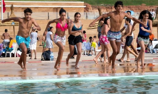 Thousands of Moroccans are flocking to the artificial pools carved into the rocky outcropping of the urban corniche in the capital Rabat