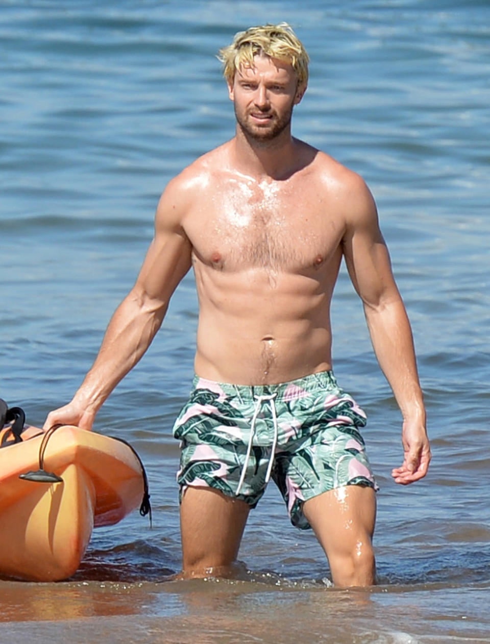 <p>Patrick Schwarzenegger shows off his new blond locks as he hits the beach to go kayaking in Maui on Jan. 16. </p>